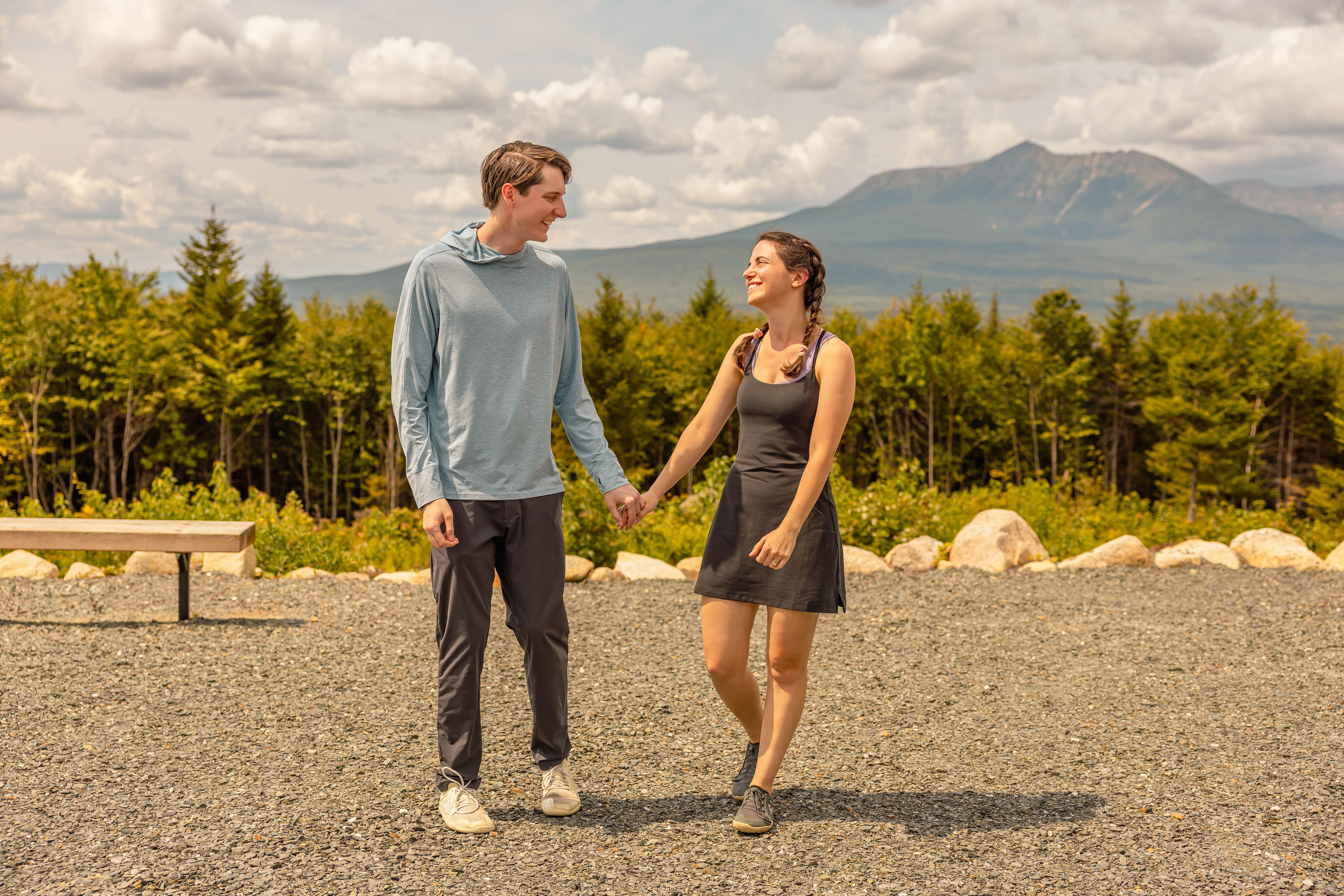 Katherine and Johnny holding hands at a mountain overlook