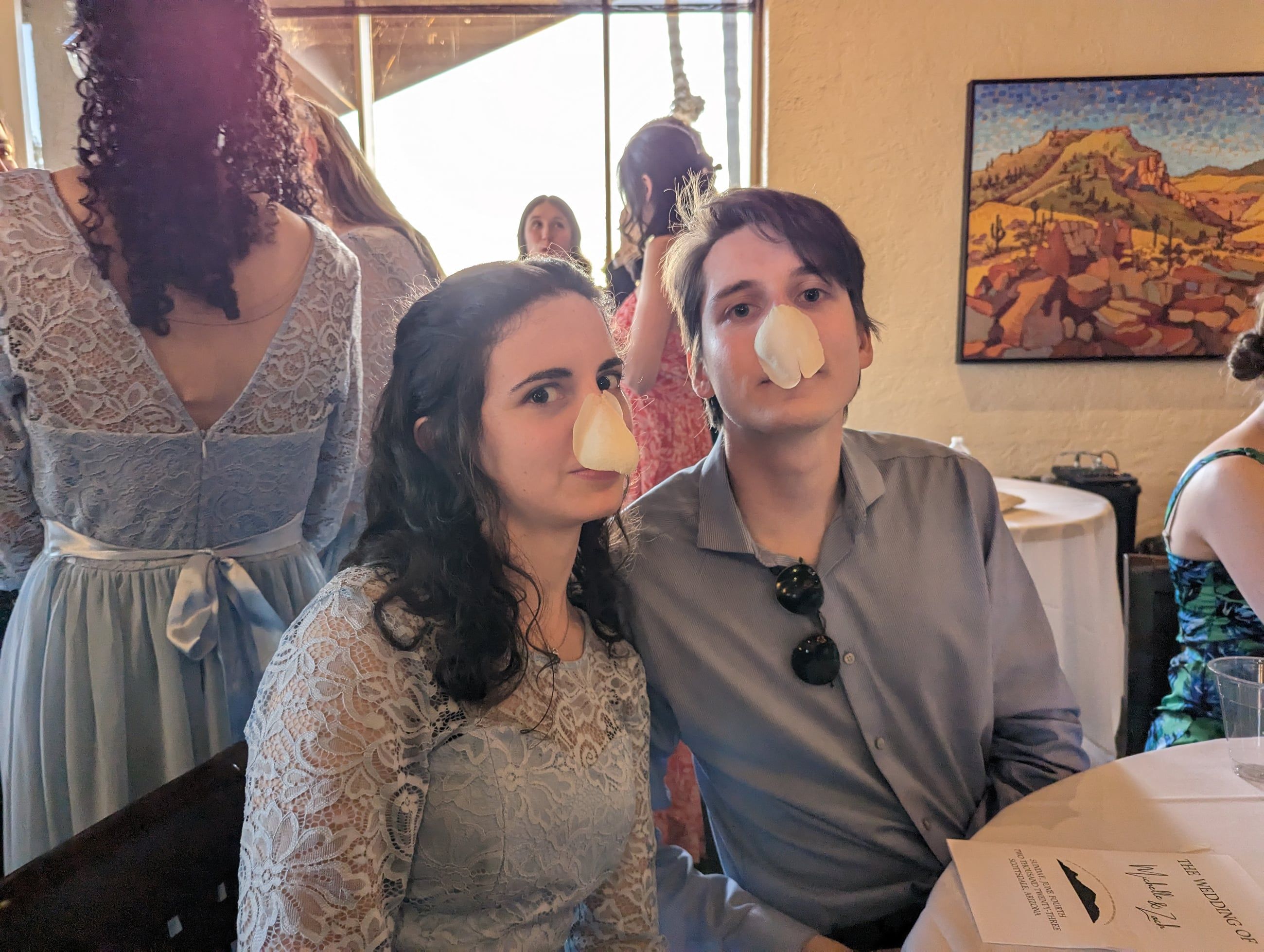 Katherine and Johnny being silly at a wedding reception